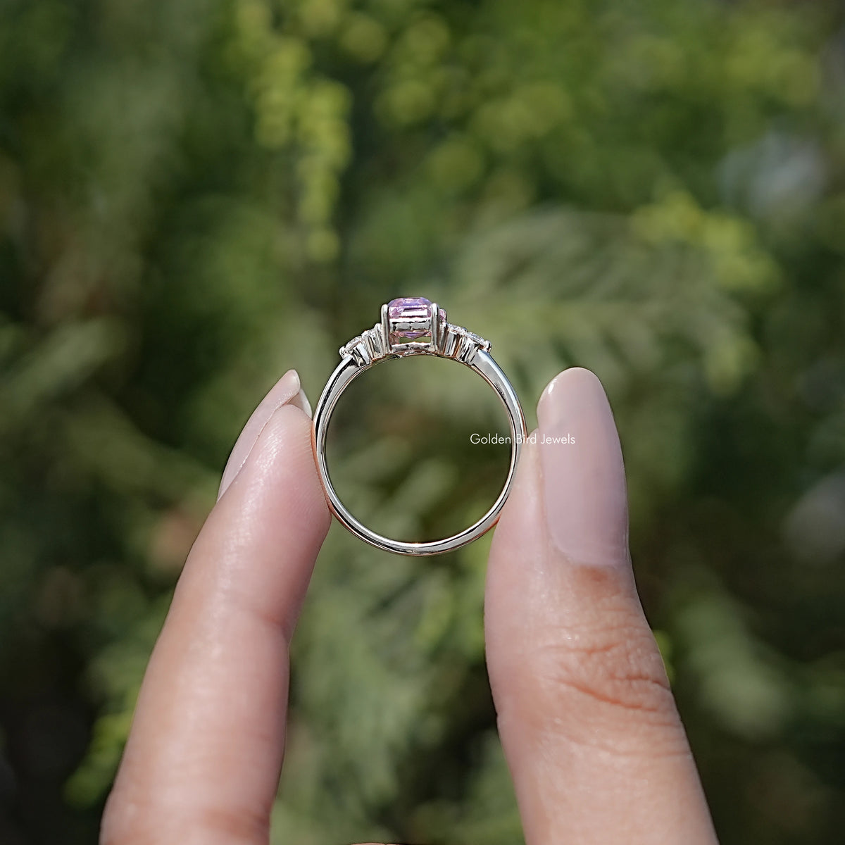 Back view of Pink Emerald Cut Moissanite Solitaire Ring in secure setting 