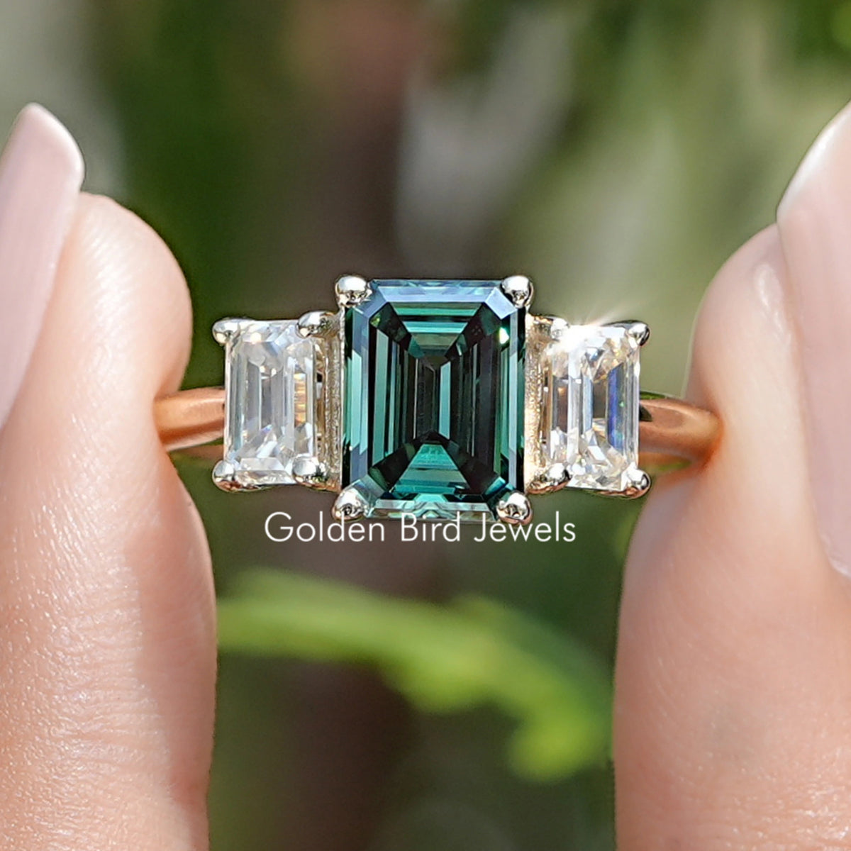Front view of Emerald Moissanite 3 Stone engagement ring   