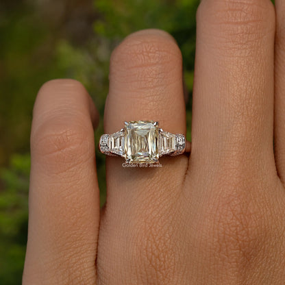 Sterling silver three-stone engagement ring with square center stone and side baguettes