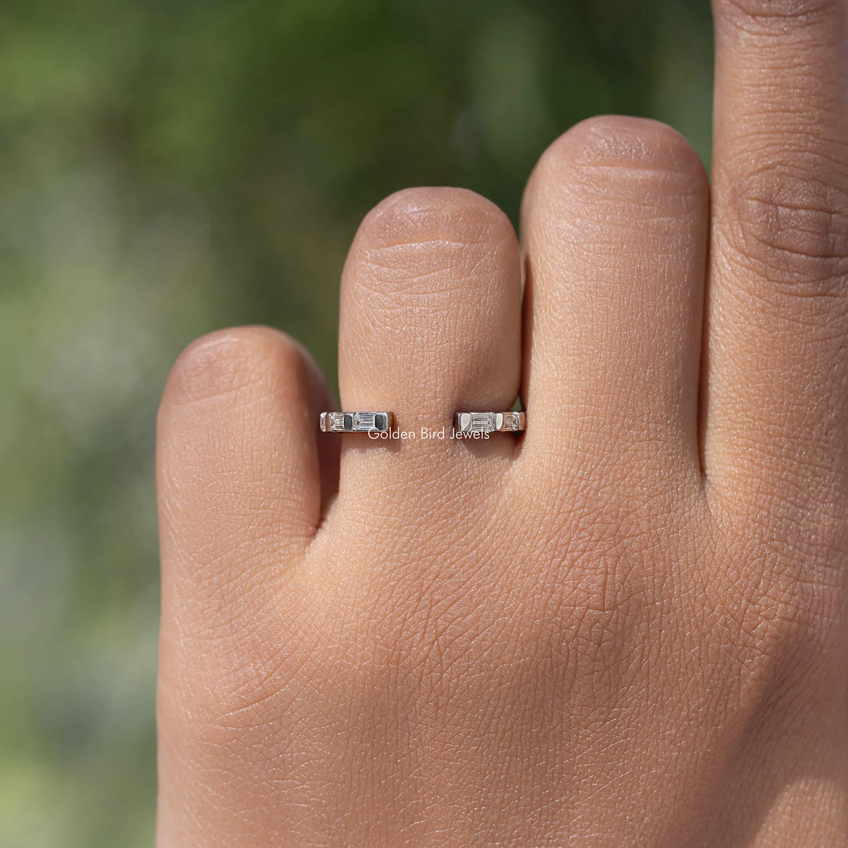 Silver moissanite baguette open-gap proposal band with bar-set stones