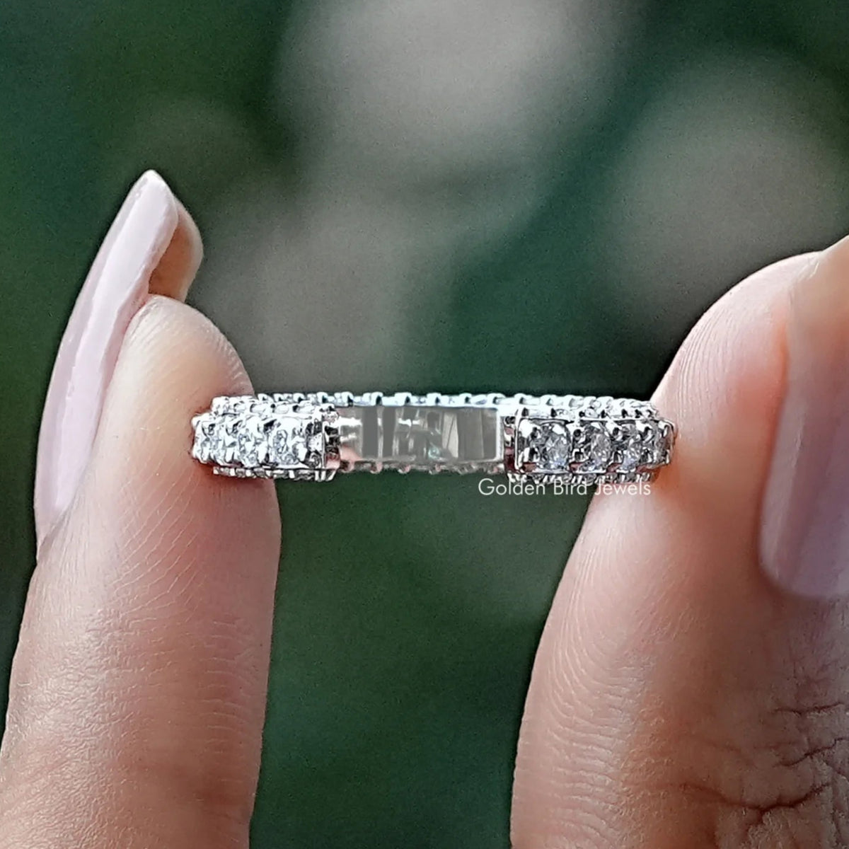 Moissanite eternity band ring with central rectangular stone, silver-tone, close-up