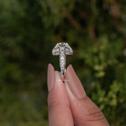 Sterling silver vintage ring with round moissanite center, detailed side prongs