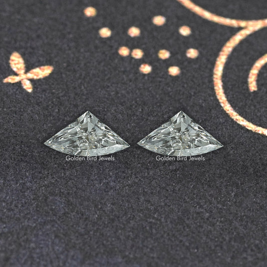 Pair of faceted marquise-shaped lab-grown diamonds, clear icy gray