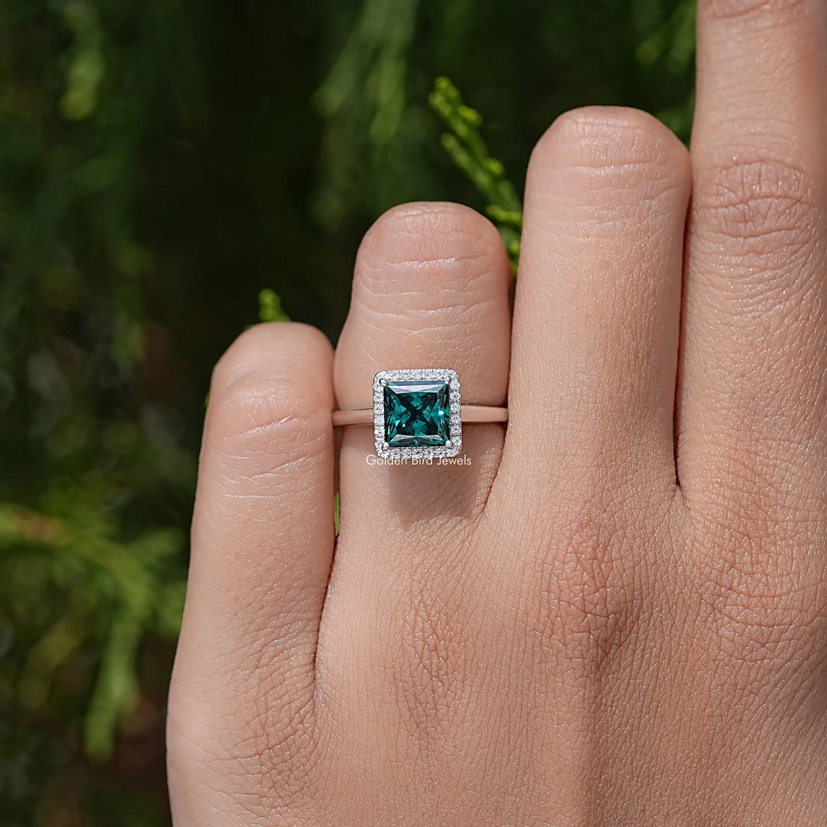 Sterling silver square teal moissanite ring with halo setting and prong details
