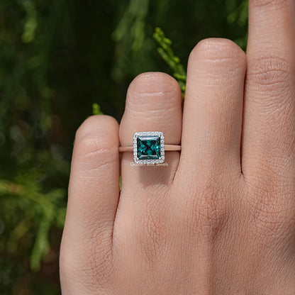 Sterling silver square teal moissanite ring with halo setting and prong details