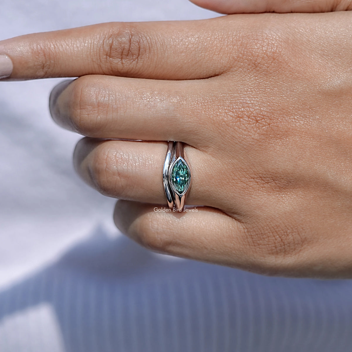 View of Green Marquise Bezel Set Moissanite Ring
