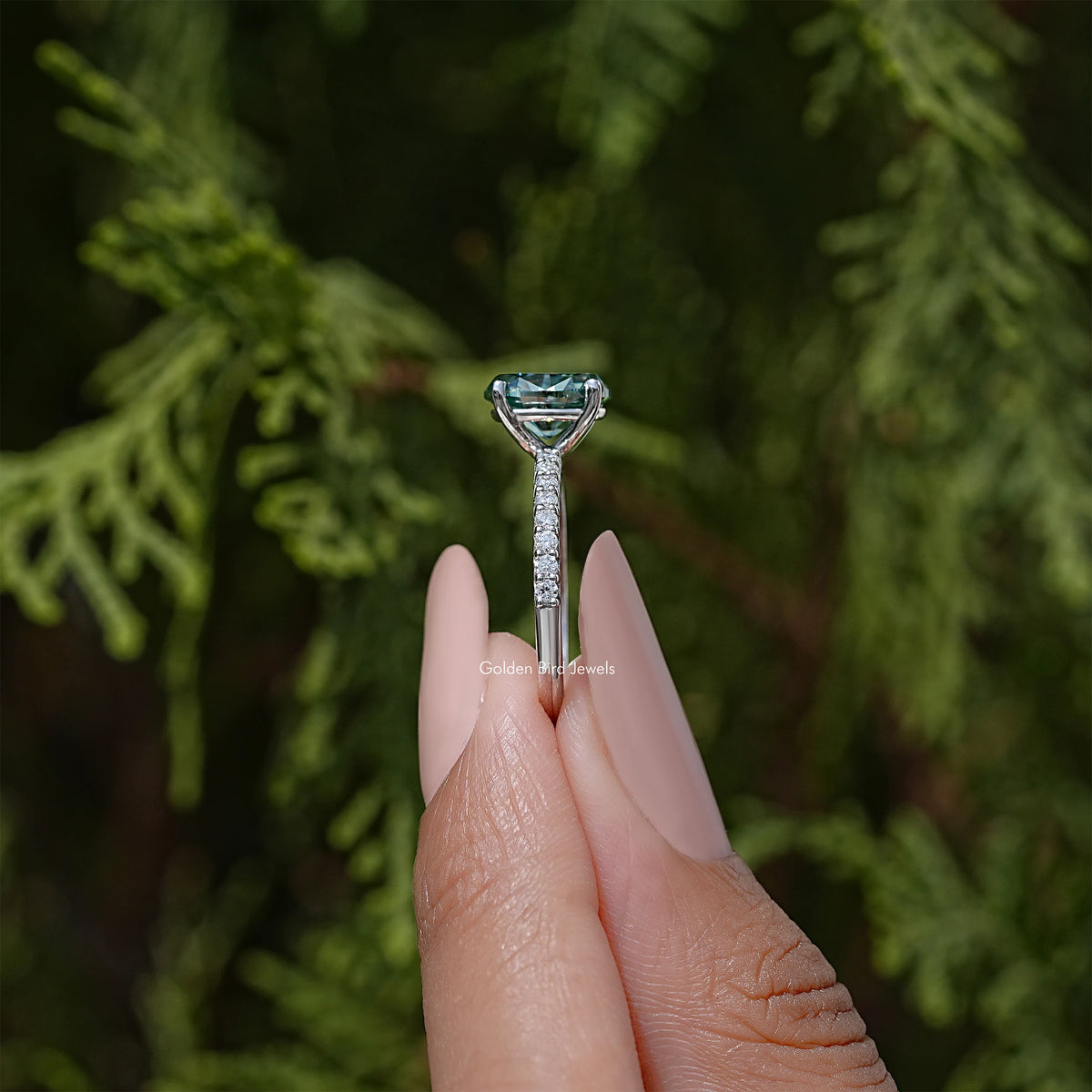 925 silver ring with teal emerald-cut center stone, four-prong setting, top view