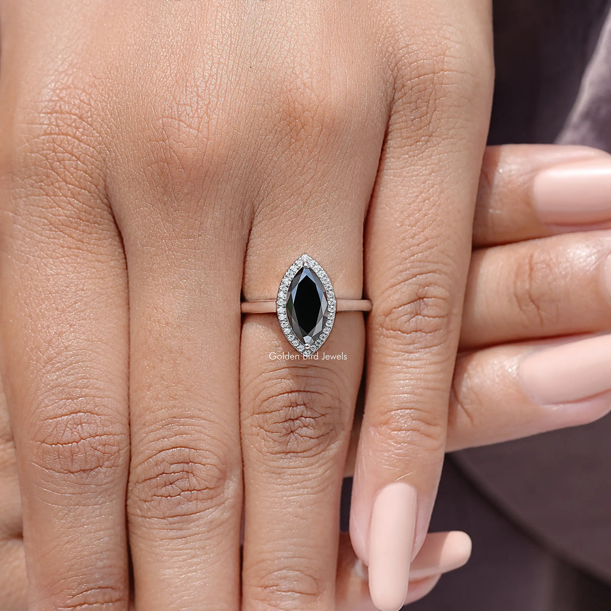 Halo marquise wedding ring in sterling silver on hand