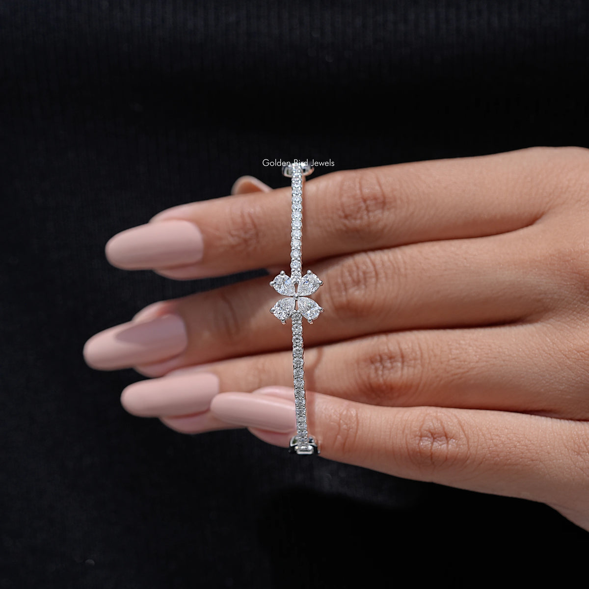 Pear-cut lab diamond flower bangle bracelet on hand