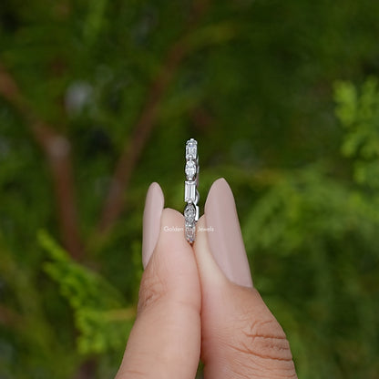 Silver eternity ring profile with marquise stones, close-up on fingertips