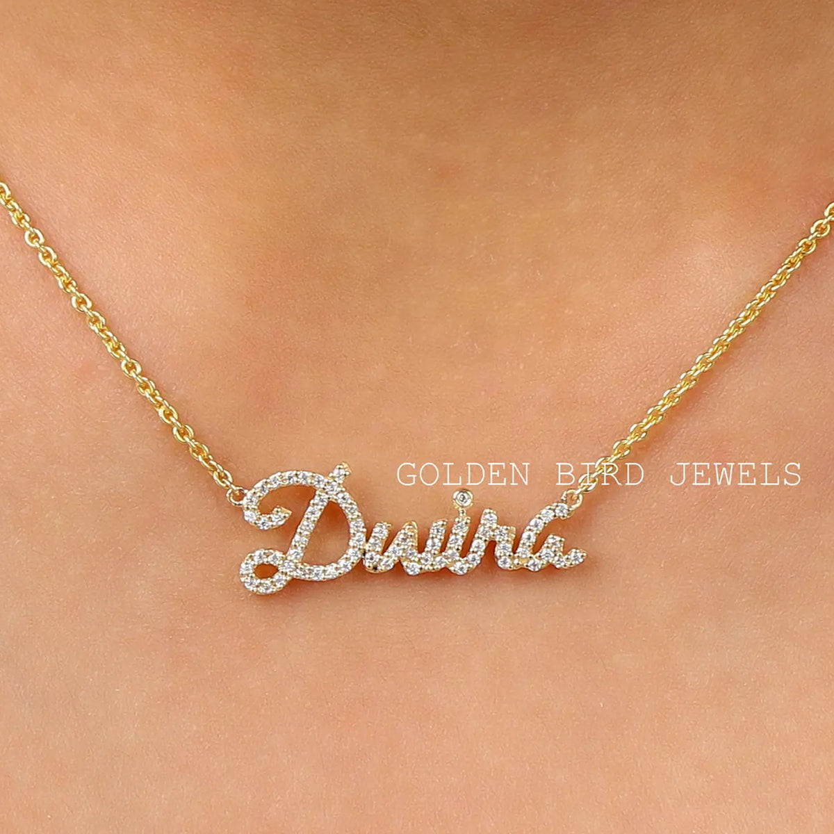 Personalized script name pendant necklace with round-cut stone detailing on gold chain