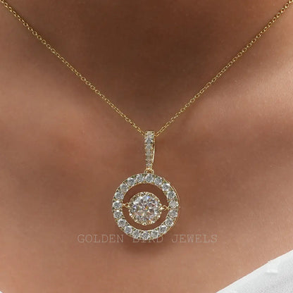 Round halo wedding pendant with large center stone, set in silver-tone frame on gold chain.
