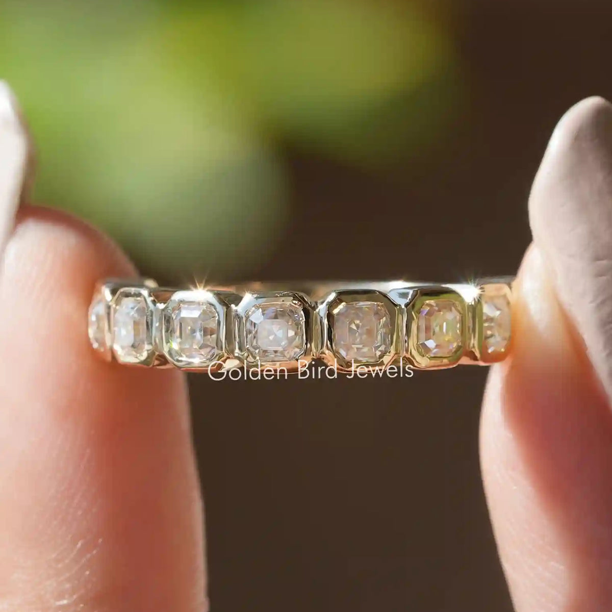 Asscher-cut moissanite wedding band with five square clear stones, silver prongs