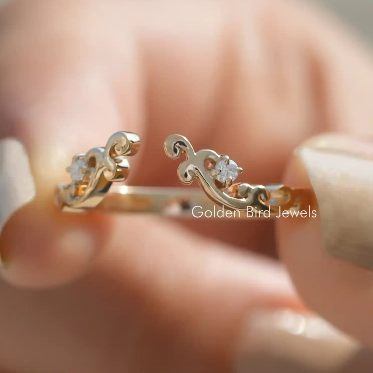Pair of gold-tone open cuff stacking band rings with round lab diamonds on fingers