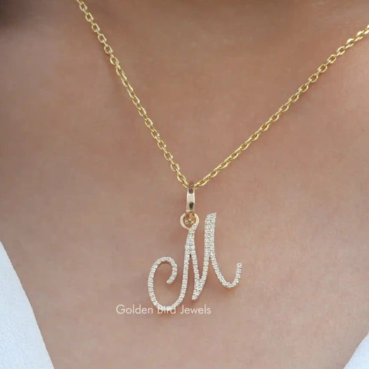 Custom letter pendant with round moissanite stones, on a gold-tone chain