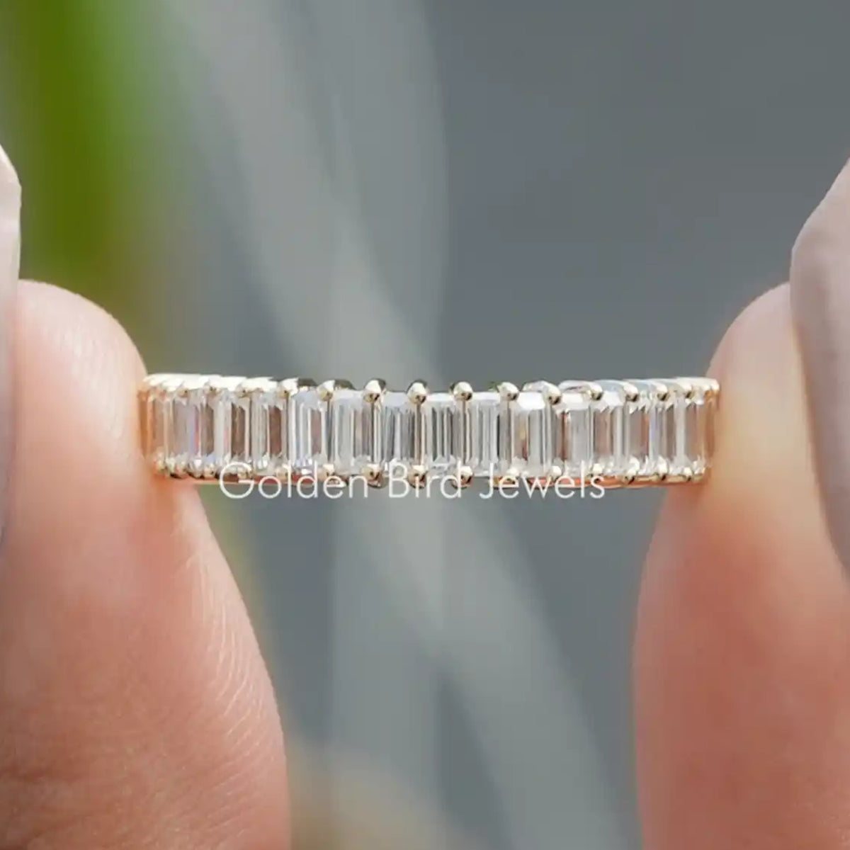 Half eternity moissanite band with baguette-cut stones, bright silver tone