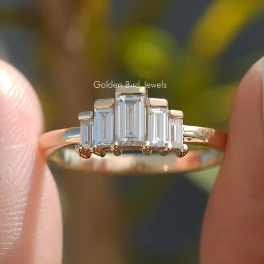Baguette moissanite bezel set ring with five rectangular stones on gold band