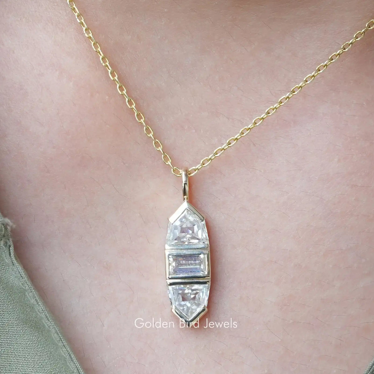 Baguette and bullet cut moissanite pendant on gold-tone chain, geometric stepped setting