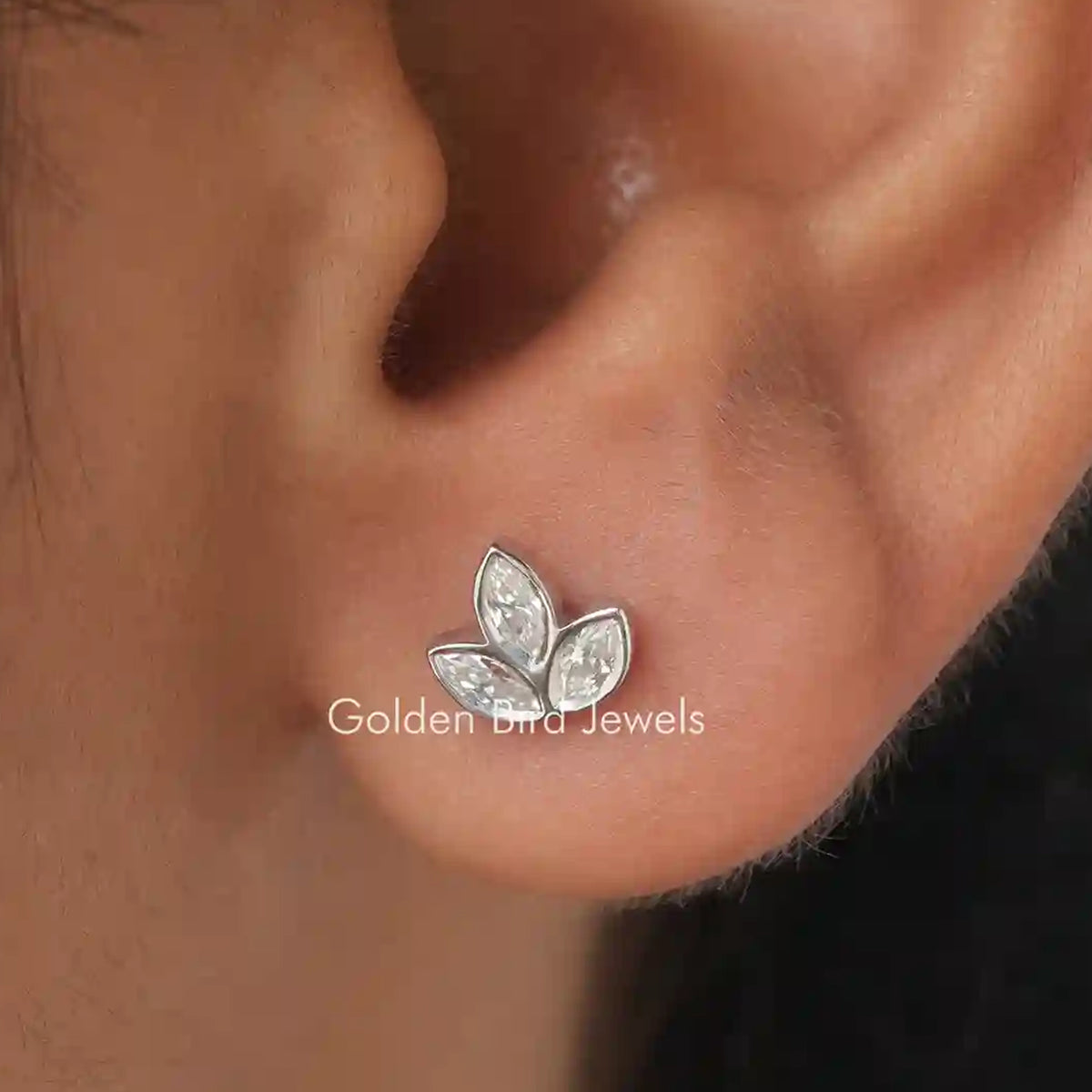 Leaf-shaped stud earrings with marquise-cut white stones