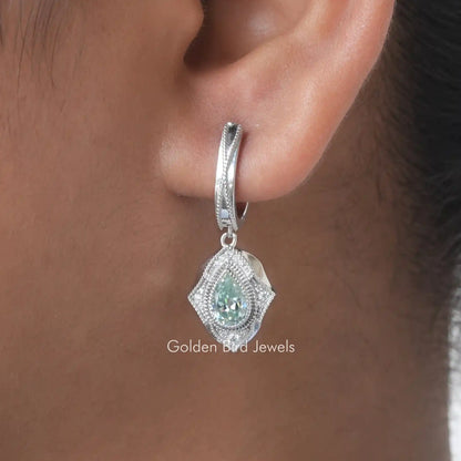 Silver dangle earring with pear-cut blue moissanite