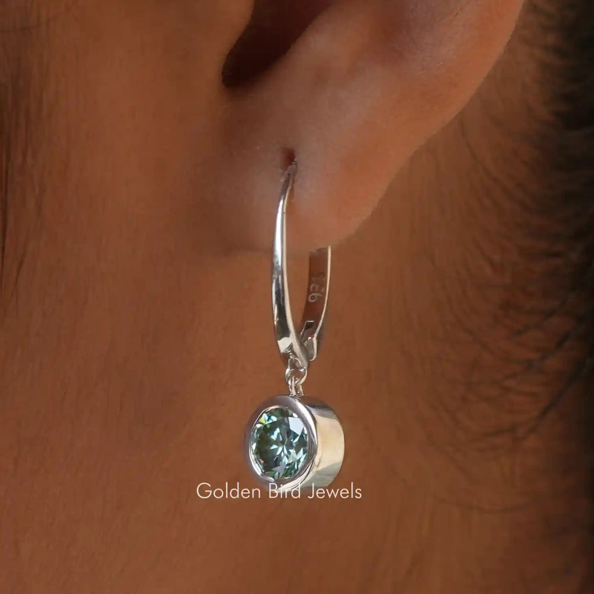 Silver hoop dangle earrings with round green-blue moissanite