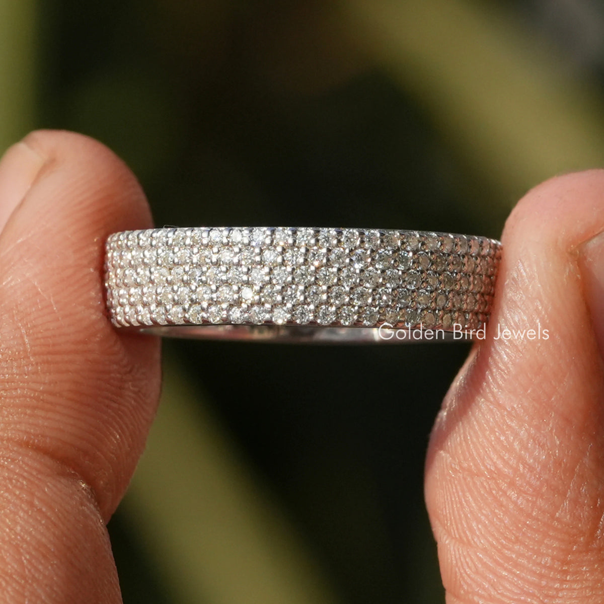 Round moissanite pavé eternity band, wide silver-toned ring with small stones