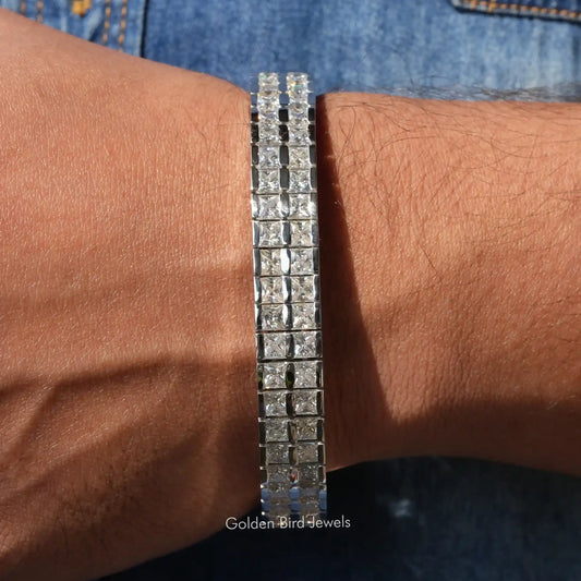 Men's tennis bracelet with square moissanite stones, slim silver band on wrist