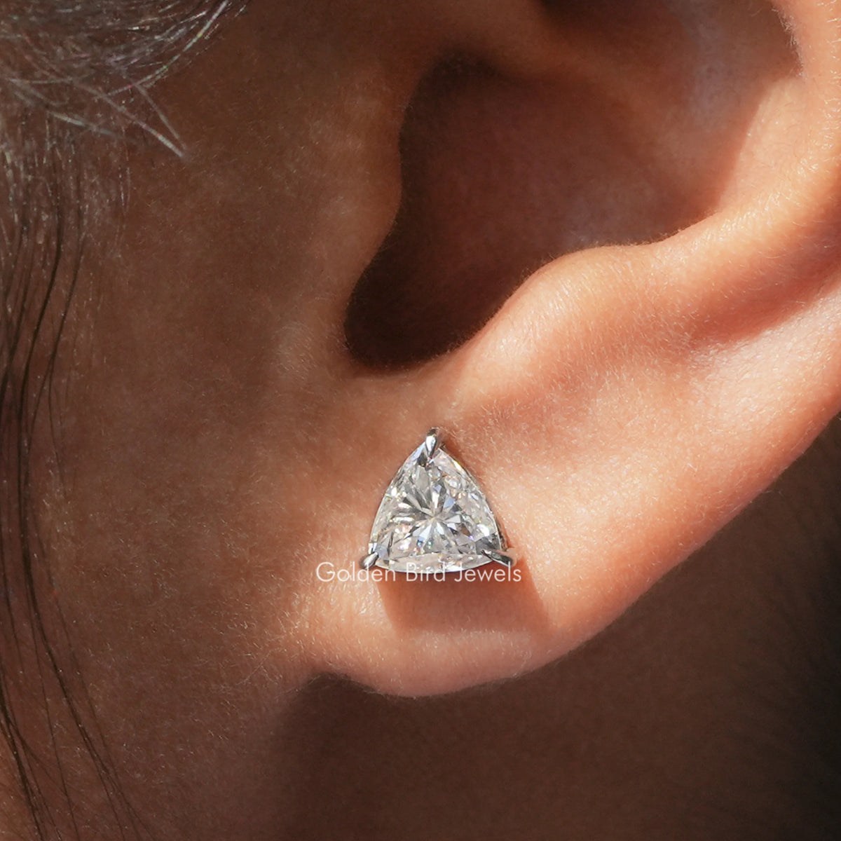Trillion-cut moissanite stud earrings with martini-style silver setting