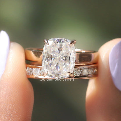 Gold-tone bridal ring set with cushion-cut colorless center stone and side accents