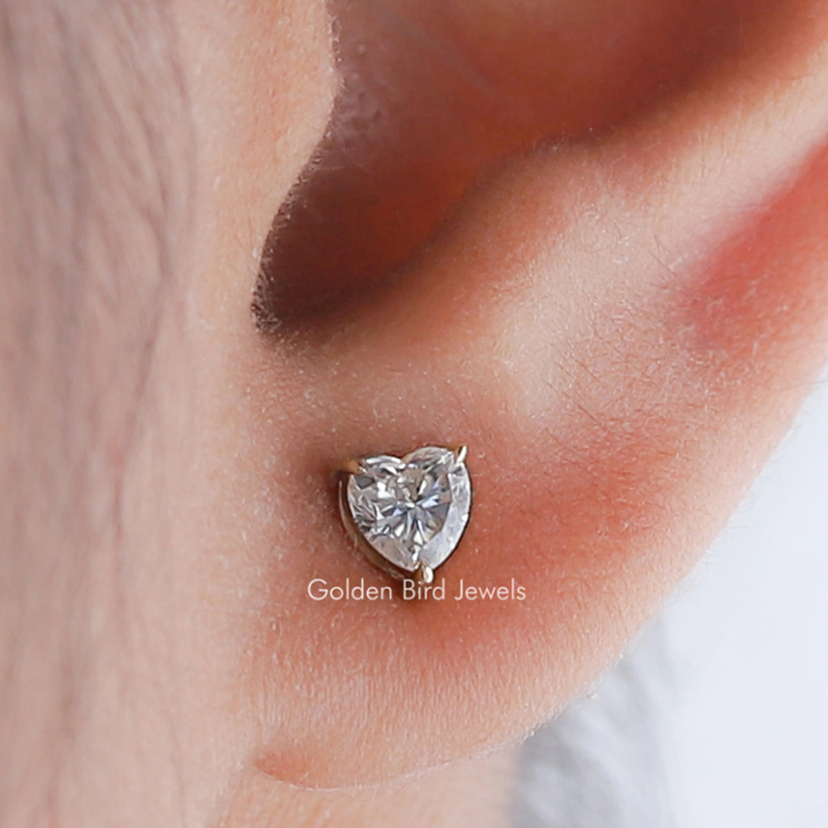 Heart-cut moissanite solitaire stud earrings, silver-tone heart shape with push-back