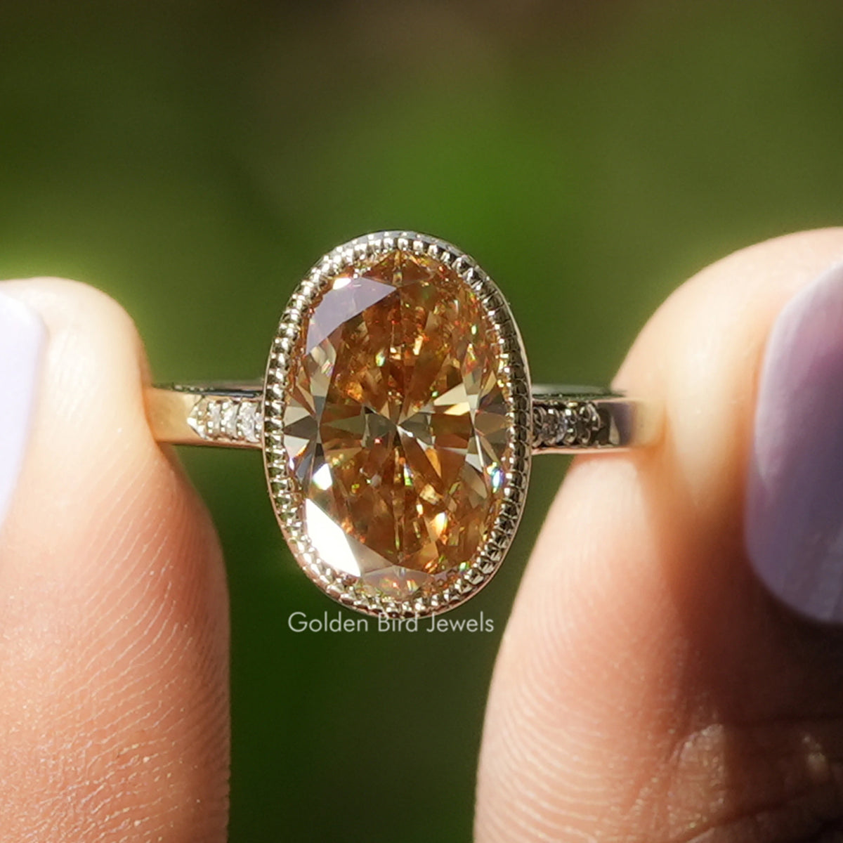 Oval-cut champagne moissanite solitaire ring with accent stones in silver