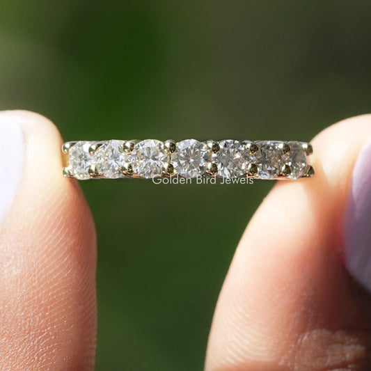 Half eternity ring with round colorless moissanite stones in a silver band