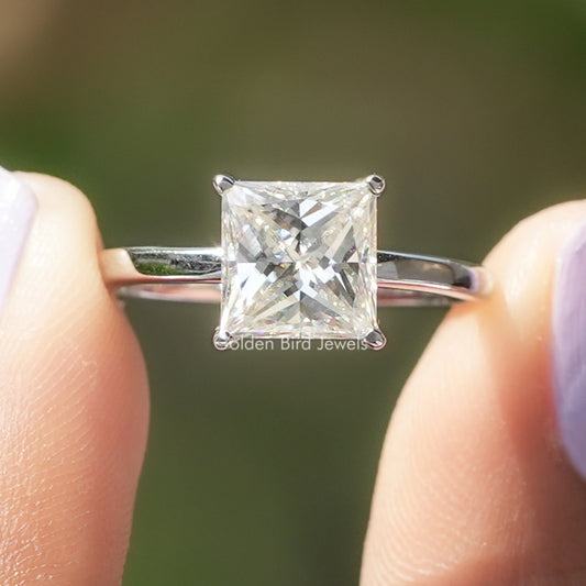 Princess-cut moissanite solitaire engagement ring in silver with four-prong setting