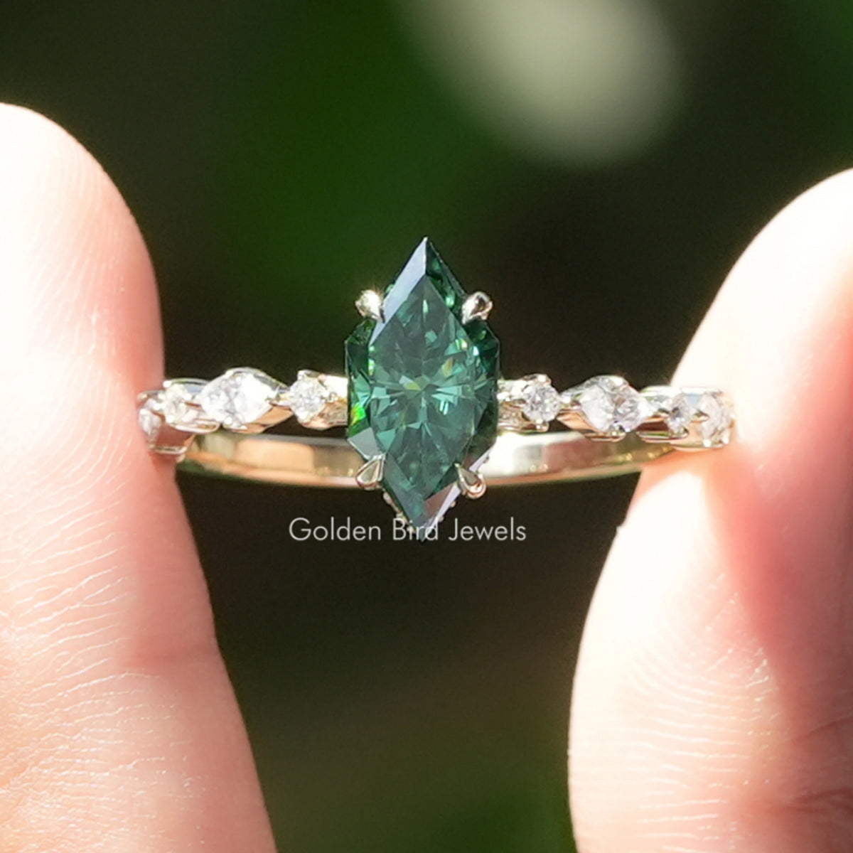 Green marquise moissanite hidden halo ring with small round side stones, silver setting