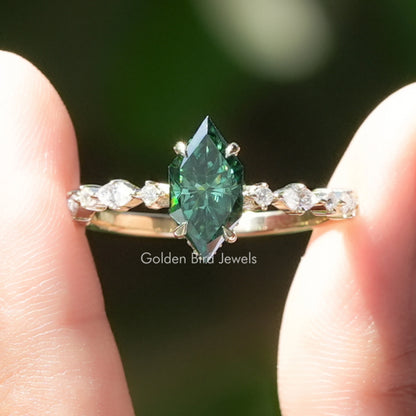 Green marquise moissanite hidden halo ring with small round side stones, silver setting
