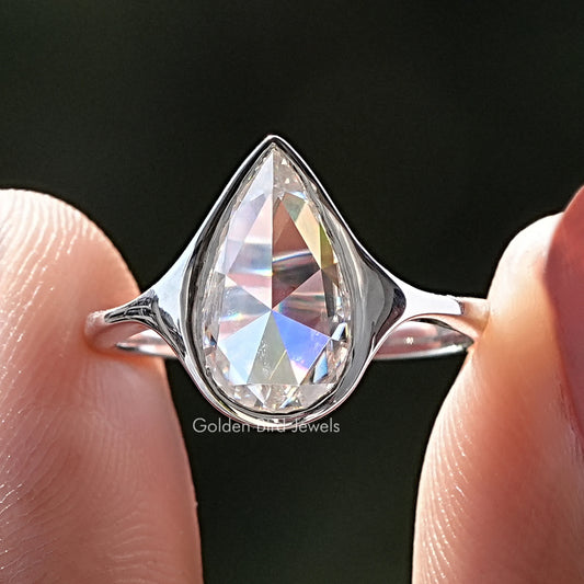Silver-tone pear moissanite bezel set ring with open band
