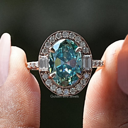 Oval blue moissanite halo ring with round and baguette stones