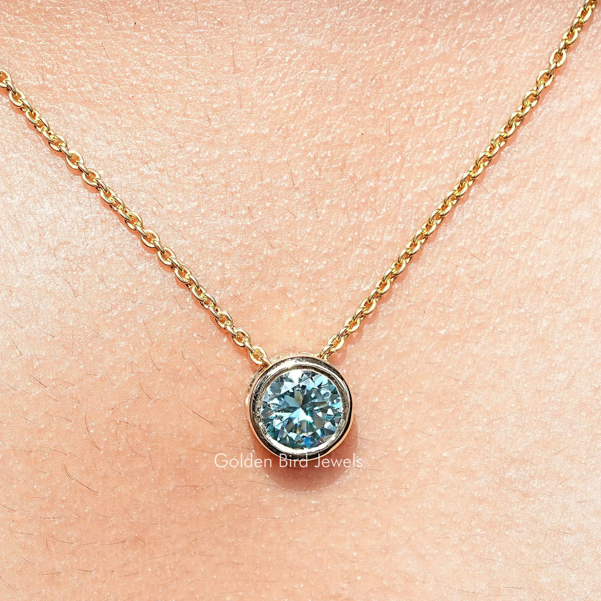 Round aqua blue moissanite solitaire pendant on gold chain