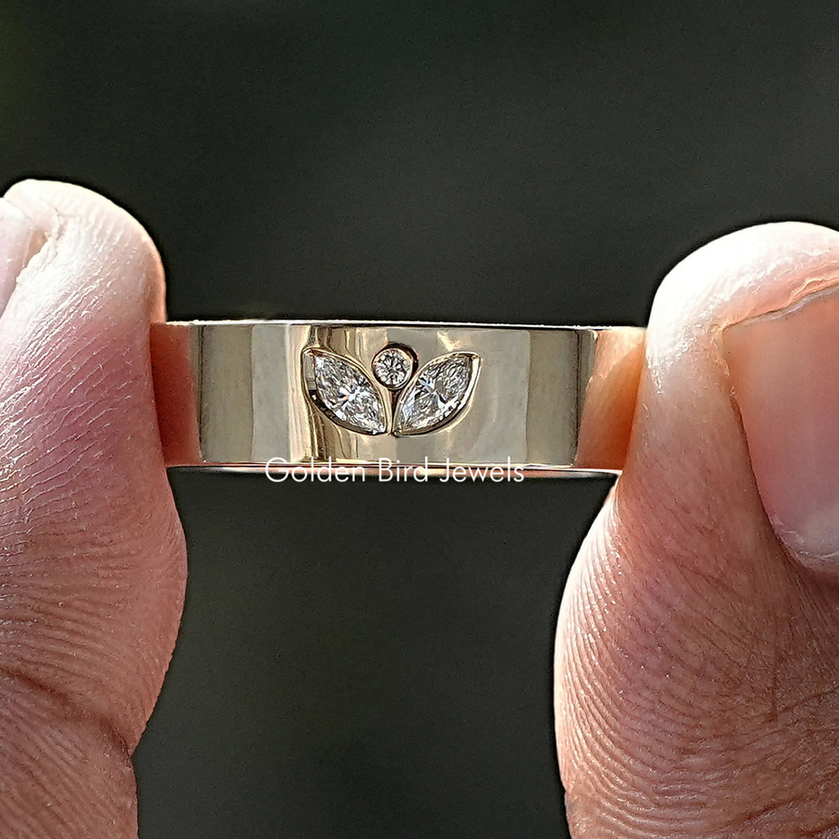 Silver flush-set men's ring with marquise-cut stones and small round accents