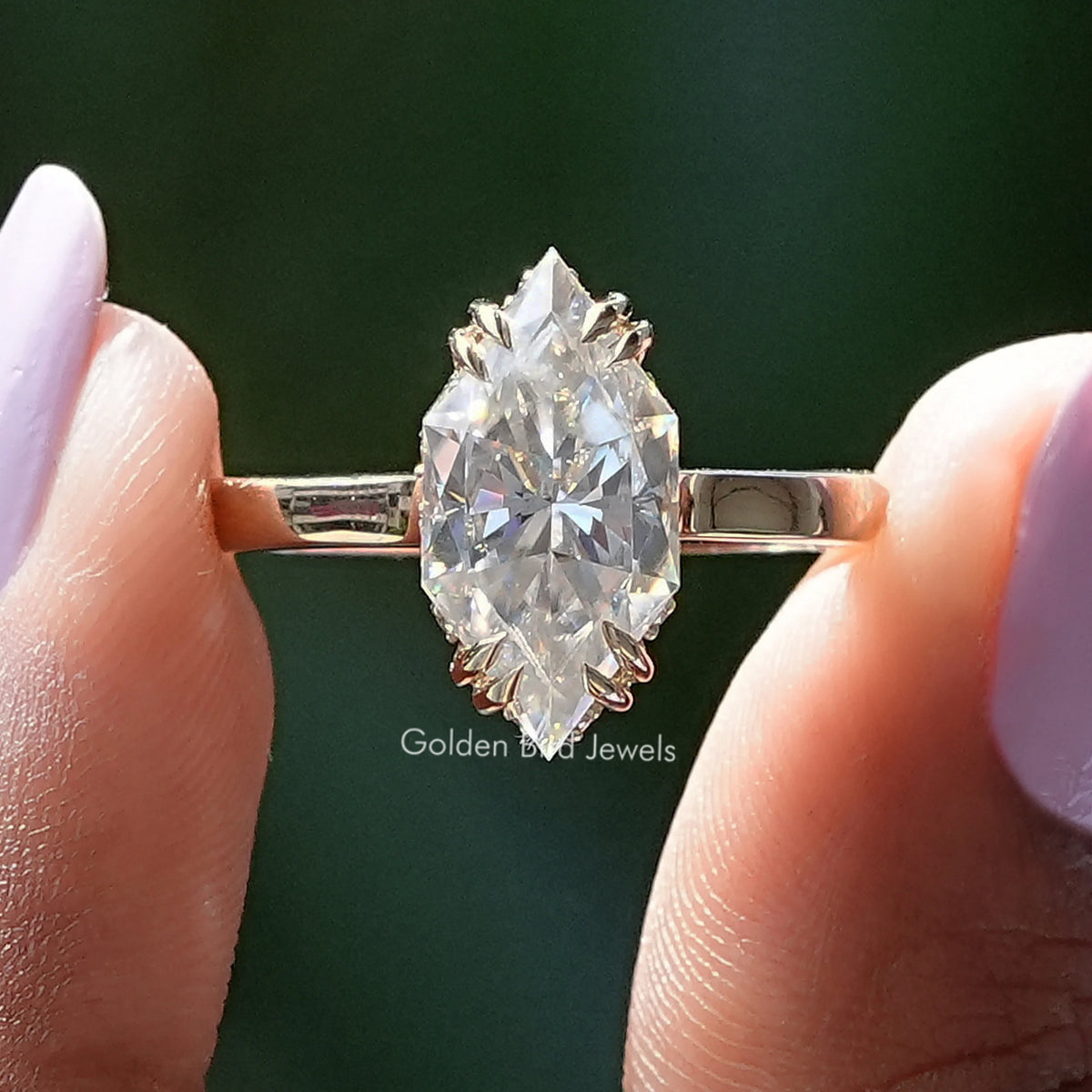 Silver ring with marquise-cut center stone and hidden halo