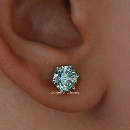 Round blue moissanite solitaire stud earring with faceted center stone in prong setting