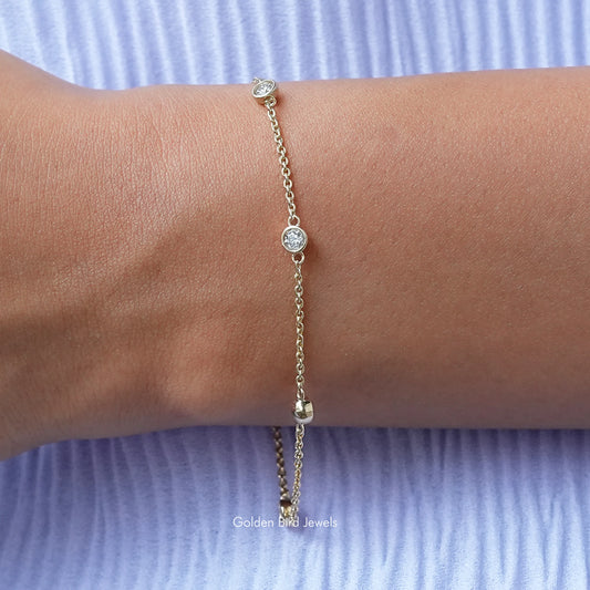 Gold-tone round bezel moissanite chain bracelet with small circular stones