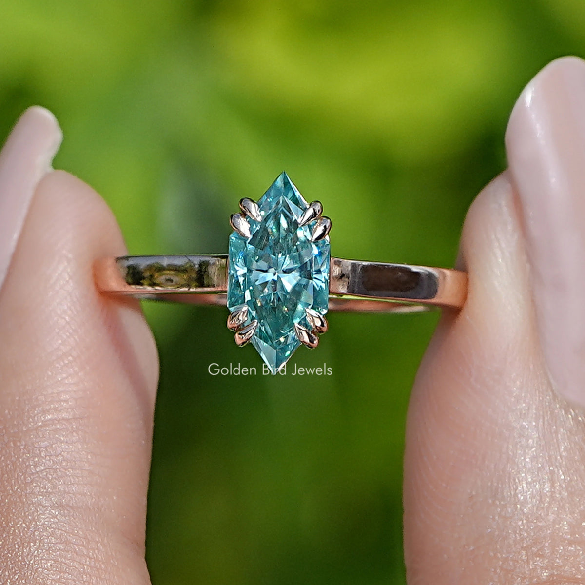 Blue marquise-cut moissanite solitaire ring with rose-gold band