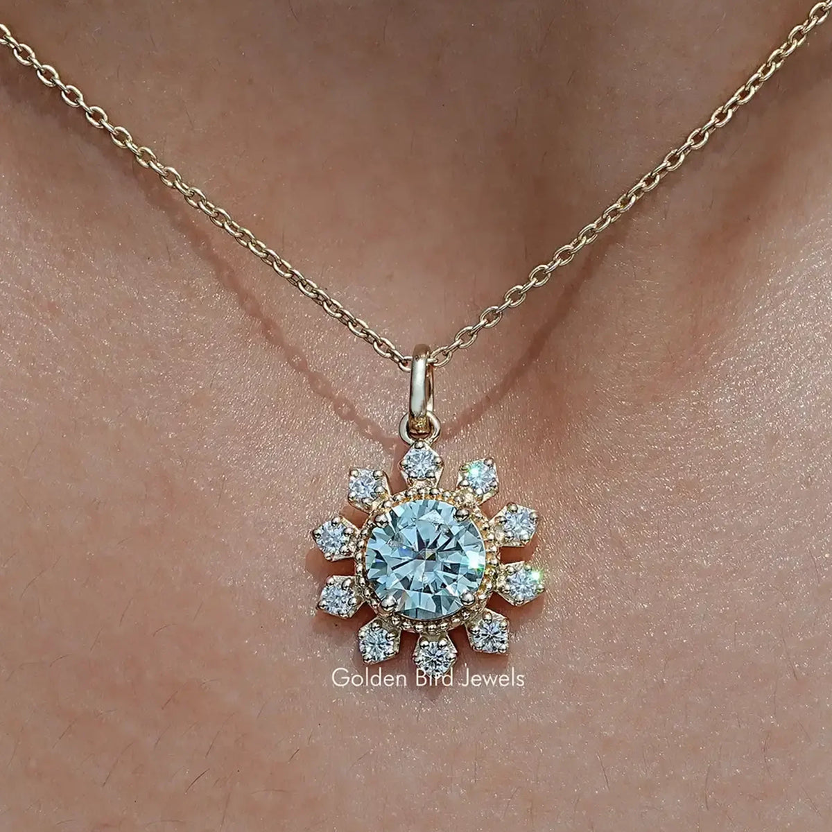 Round flower moissanite pendant with blue center stone and small round side stones on chain