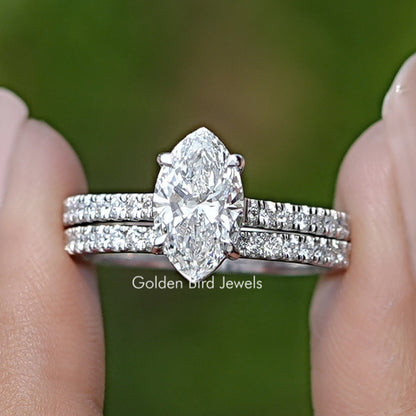 Marquise Cut Lab Grown Diamond Bridal Ring Held Between Fingers