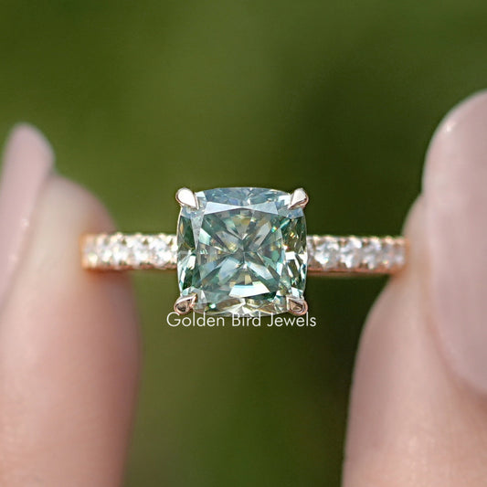 Silver-toned engagement ring with cushion-cut moissanite and small side stones