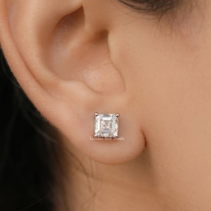 Asscher-cut moissanite stud earring with square stone bezel in white gold.
