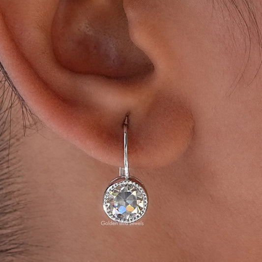 Round moissanite dangle earring with prong-set round clear stone