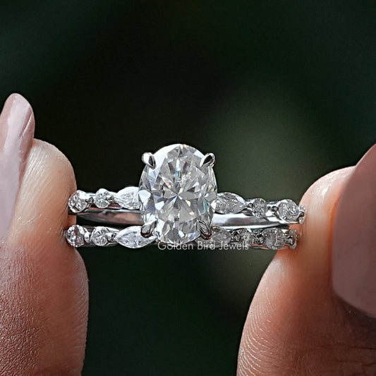 Silver bridal ring set with large round center stone and pave side accents