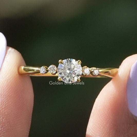 Gold tone five-stone round diamond accent ring with center round stone